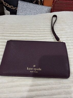 kate spade Plum Textured Wristlet Clutch with Gold Logo